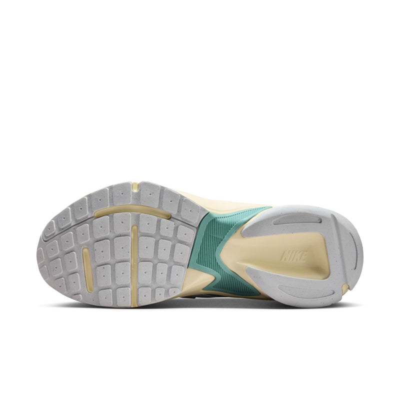 Women's outsole view with grippy tread and teal/light gray sole panels