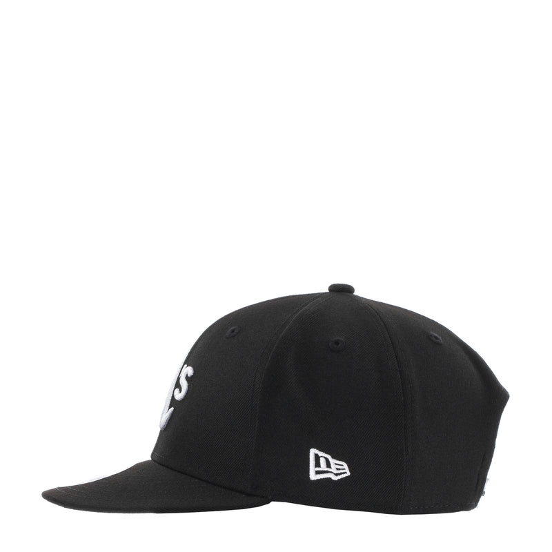 Black baseball cap with New Era logo and partial white A’s mark