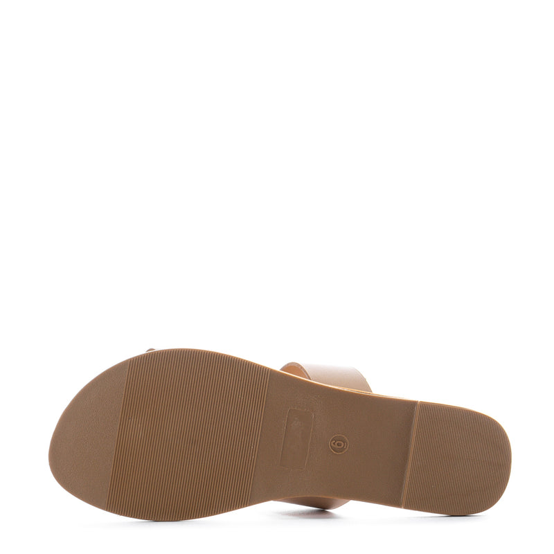 Tan womens sandal outsole with ribbed tread under two-strap upper