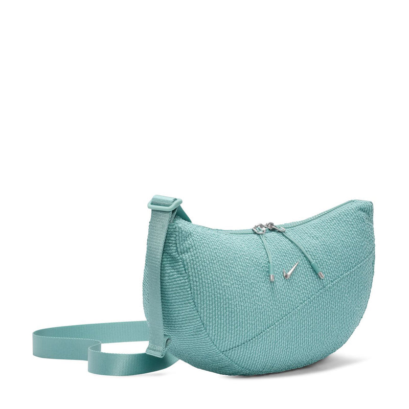 Turquoise crescent crossbody bag with zipper closure and adjustable crossbody strap