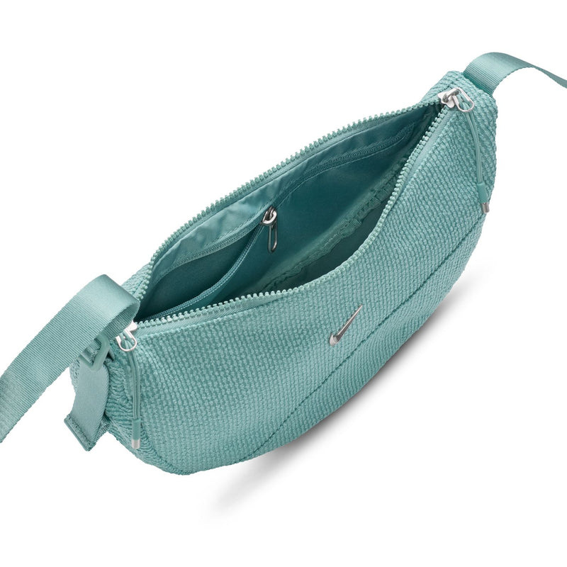Turquoise crescent crossbody bag open view with top zipper and fabric interior