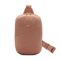 Rose gold crossbody sling bag with top handle, front zip pocket, Swoosh logo