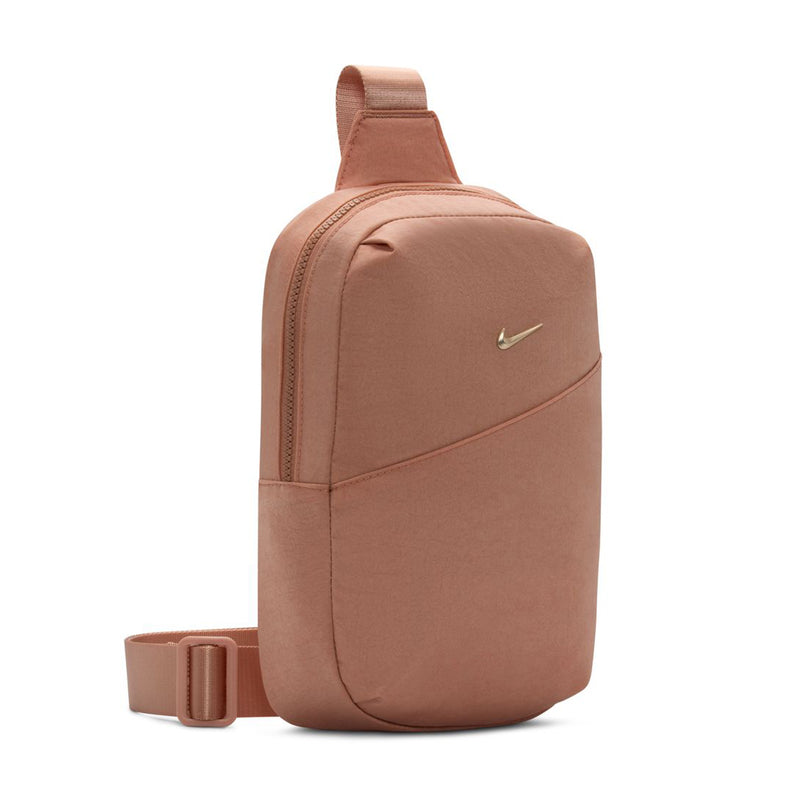 Rose gold crossbody sling bag, side view with adjustable shoulder strap and Swoosh