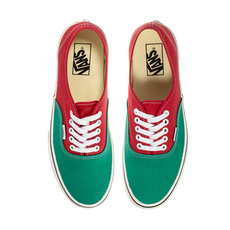 Men's low-top sneakers showing inner tongue label; red and green uppers, white laces.