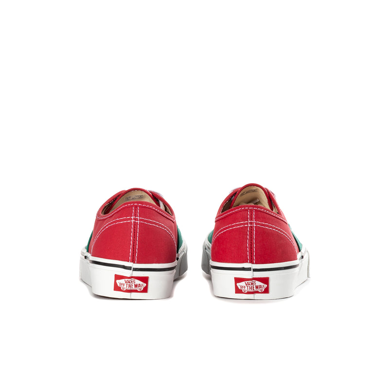 Men's low-top sneakers heel view with red back, green side, and white rubber sole.