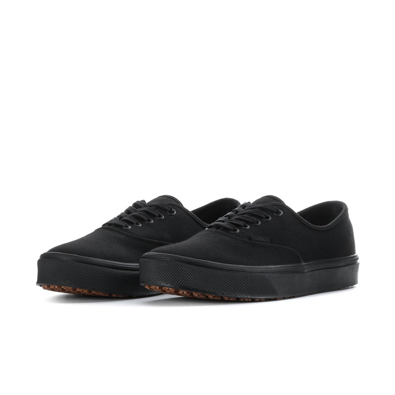 Men's black canvas low-top sneakers with lace-up front and gum-textured sole