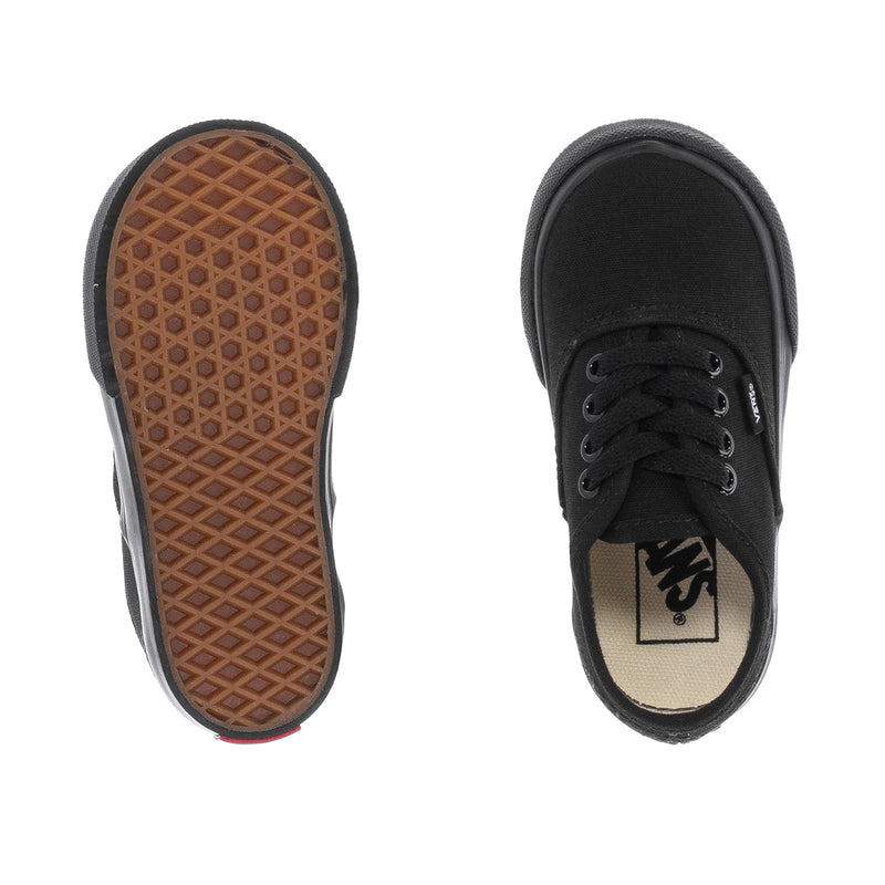 Toddler black low-top sneakers, rubber outsole tread and Vans insole label