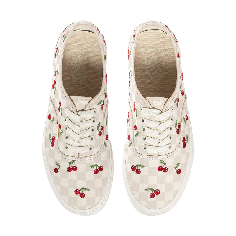Women’s lace-up sneakers with red cherries and checkerboard panel, front view