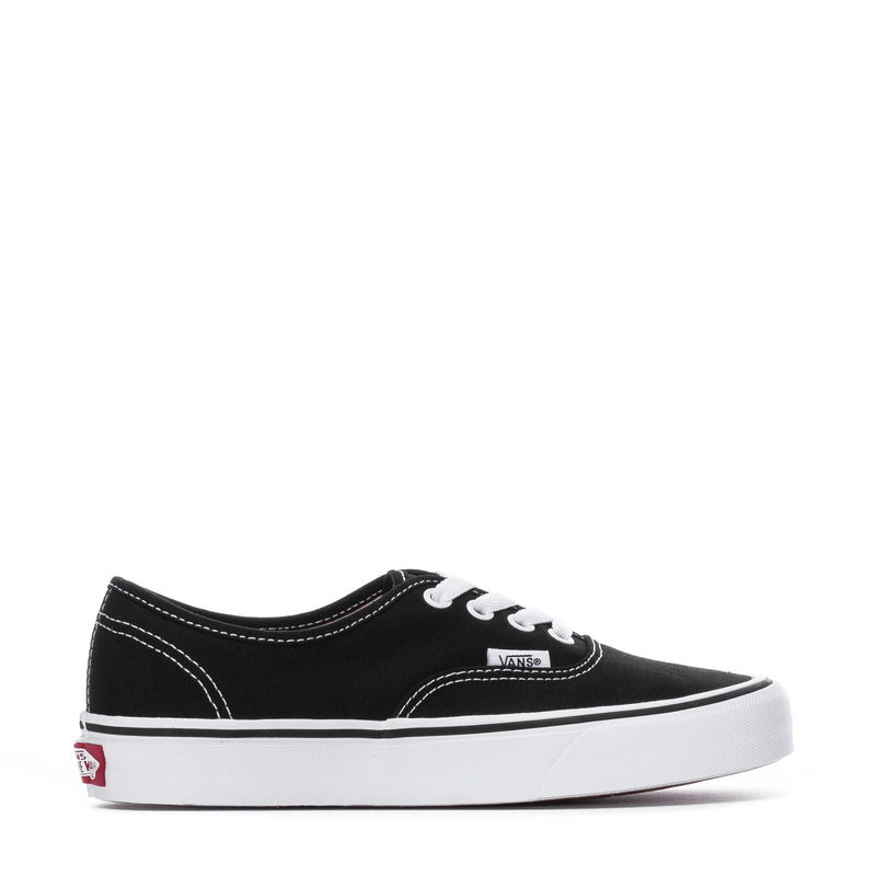 Black low-top canvas sneaker with white lace-up and Vans logo patch