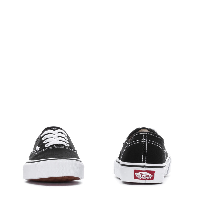 Black low-top sneaker pair showing front lace eyelets and rear heel tab