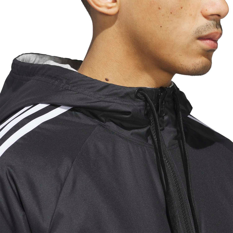 Men's black zip-up track jacket close-up at neck with textured hood and zipper