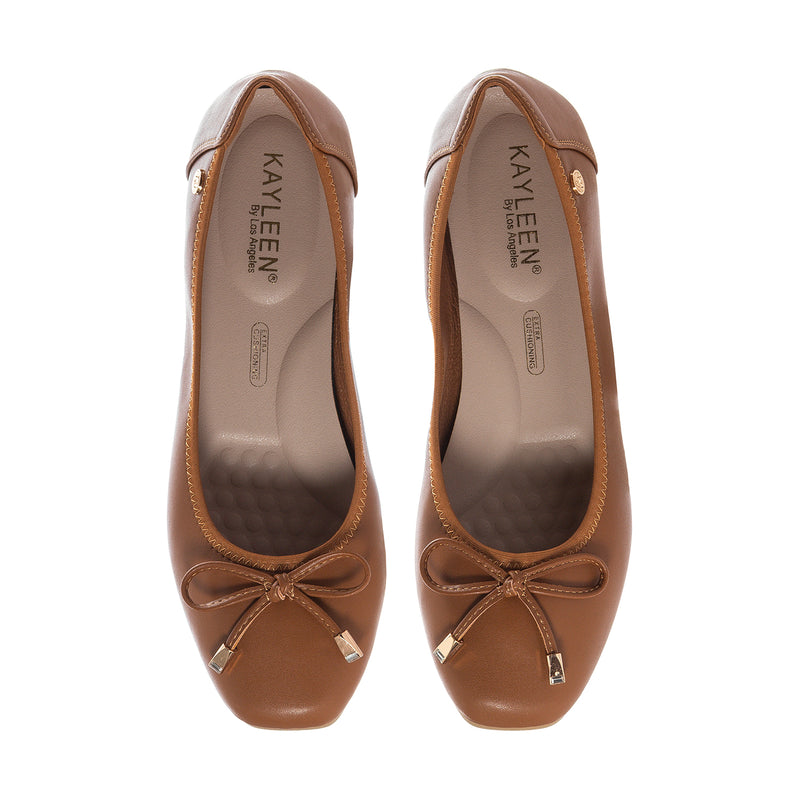 Camel ballet flats showing KAYLEN insole and bow-tie toe detail