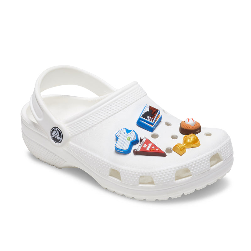 Baseball Jibbitz charms on white clogs: five multicolor pieces, including baseball and bat
