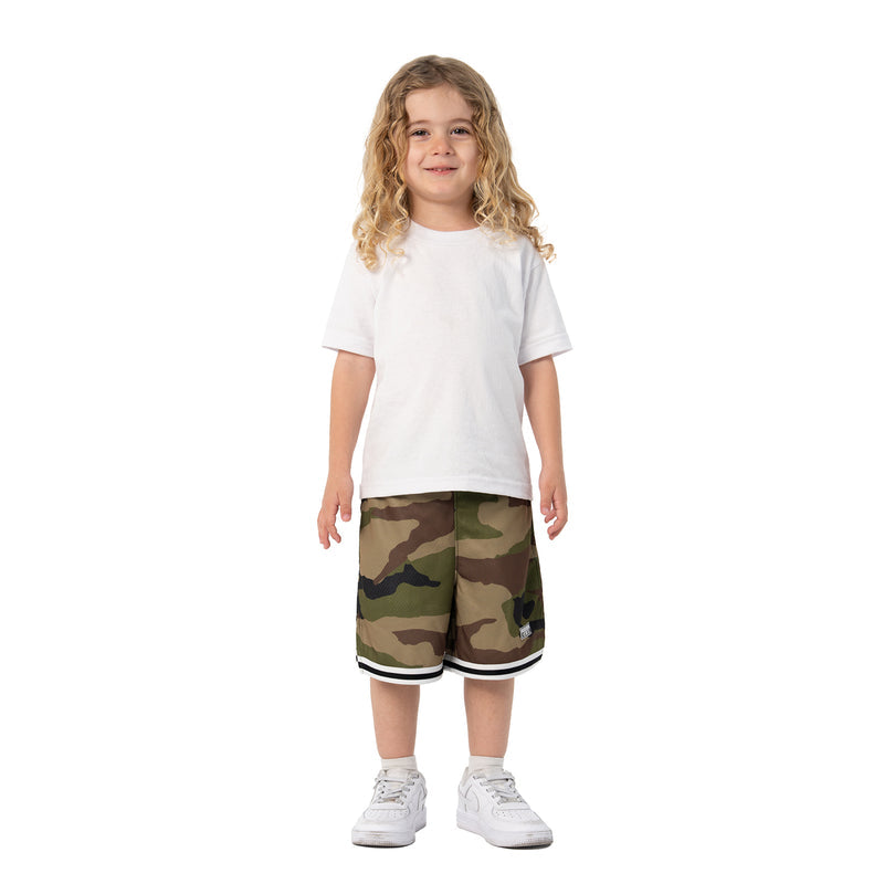 Youth camo basketball shorts on child, white-and-black hem trim