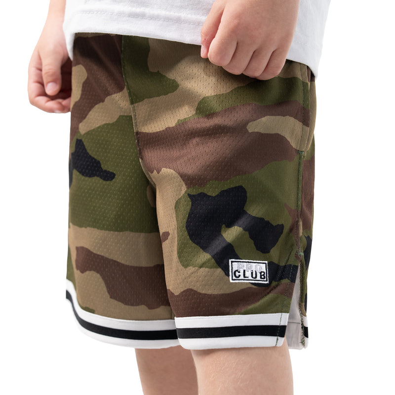 Youth camo basketball shorts close-up, CLUB logo patch on thigh