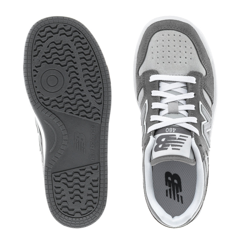 Kids' wide sneaker outsole and heel view with gray traction sole and white trim