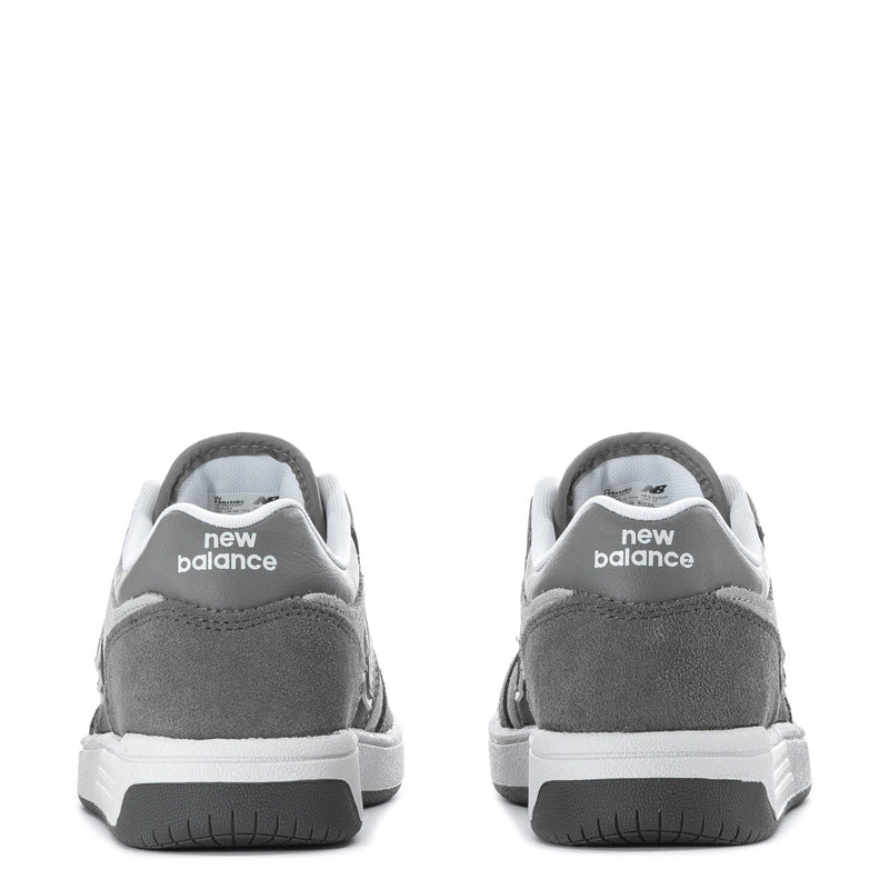 Kids' wide sneakers heel view in gray suede with New Balance branding on back