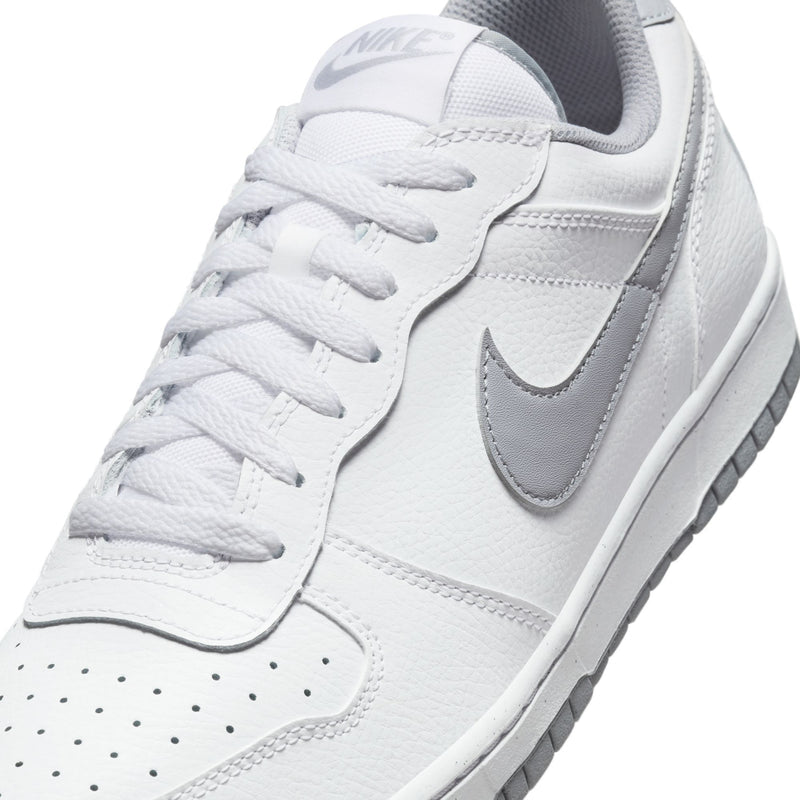 White Nike low-top sneaker close-up with lace-up vamp and Wolf Grey Swoosh