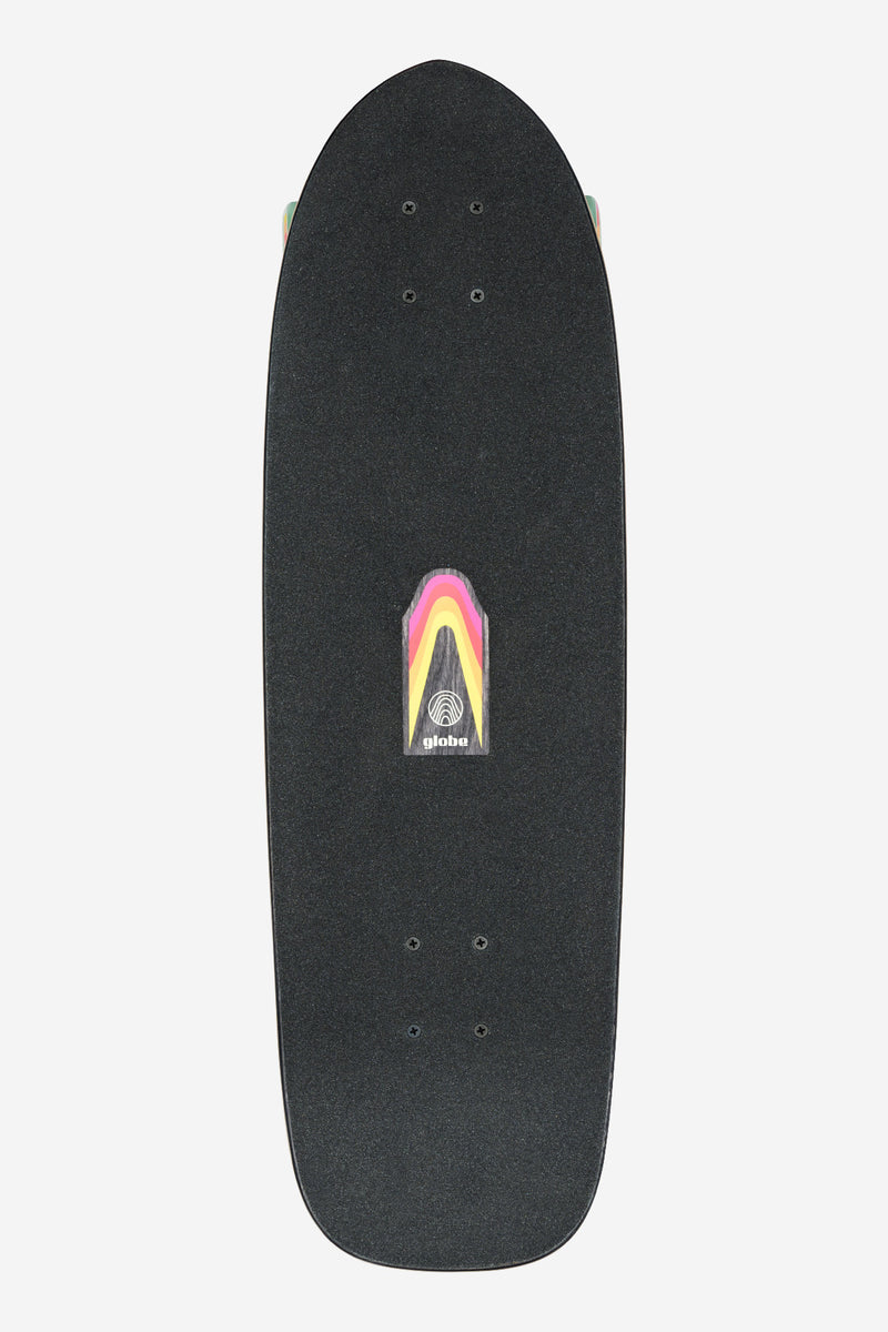 Top view of a black grip taped cruiser deck with a colorful rainbow sticker and partial trucks visible