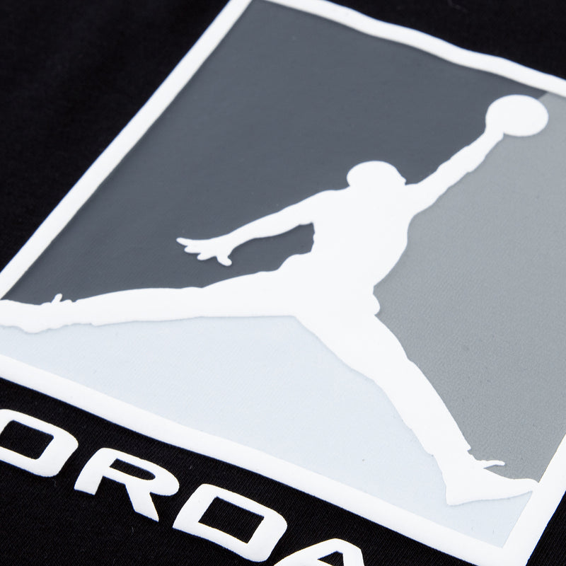 Kids black T-shirt front logo graphic close-up