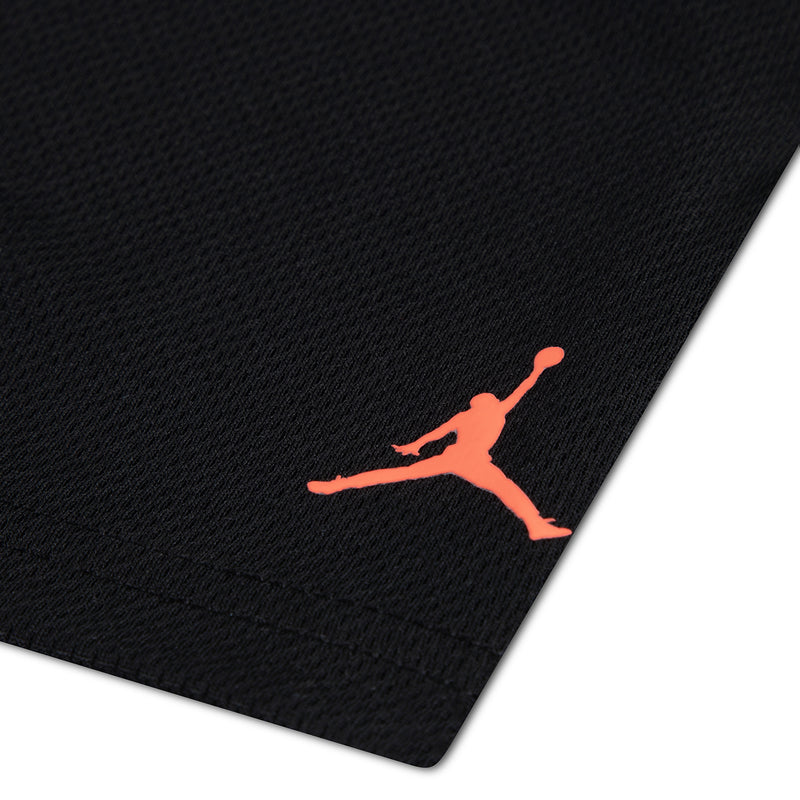 Kids black shorts with small orange Jordan Jumpman logo on leg