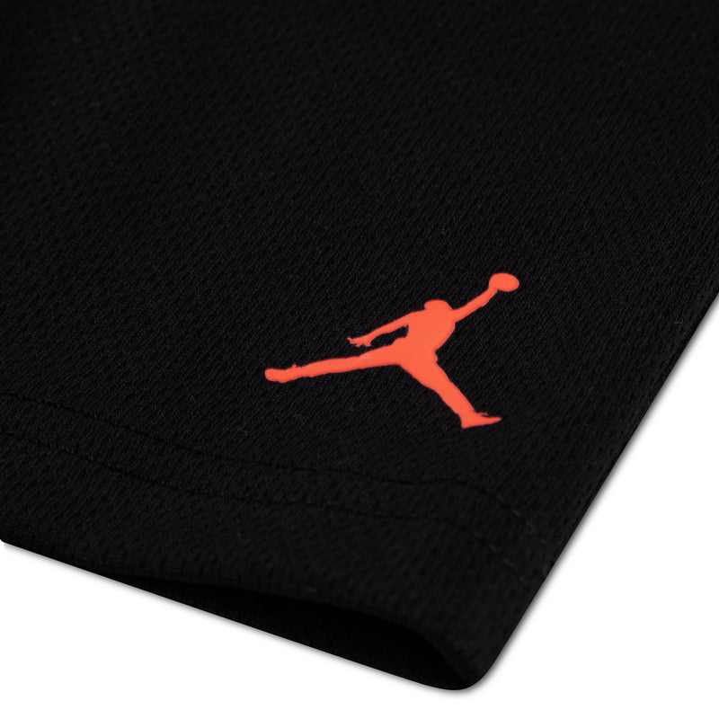 Black mesh shorts with small red Jumpman logo on the leg.