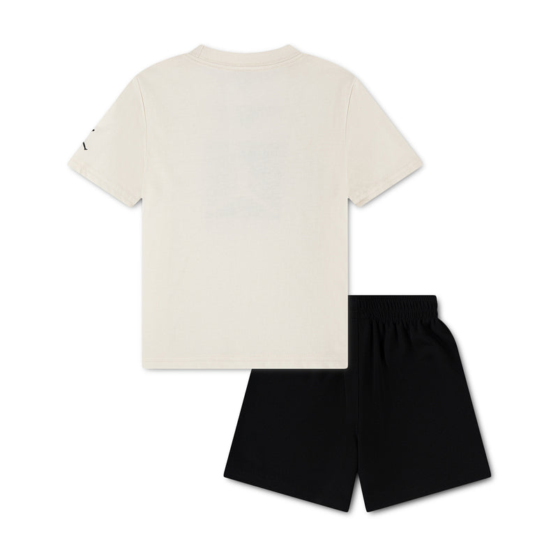 Toddler two-piece short set with ivory T-shirt and black shorts, no visible logo.