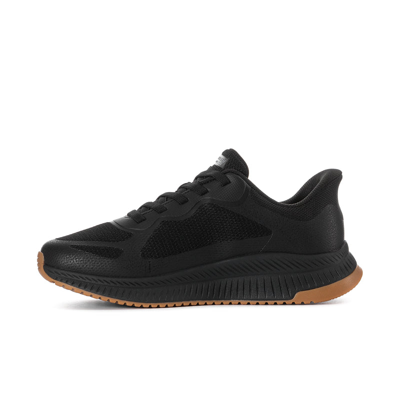 Men's black slip-on athletic shoes with textured upper and gum outsole