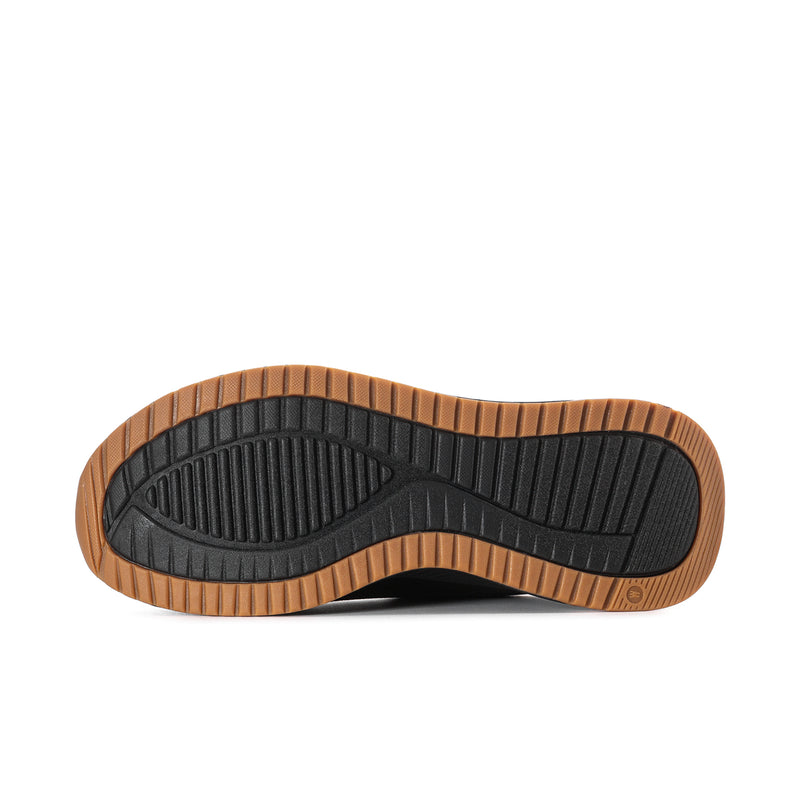 Black outsole tread with gum border on men's slip-on sneakers