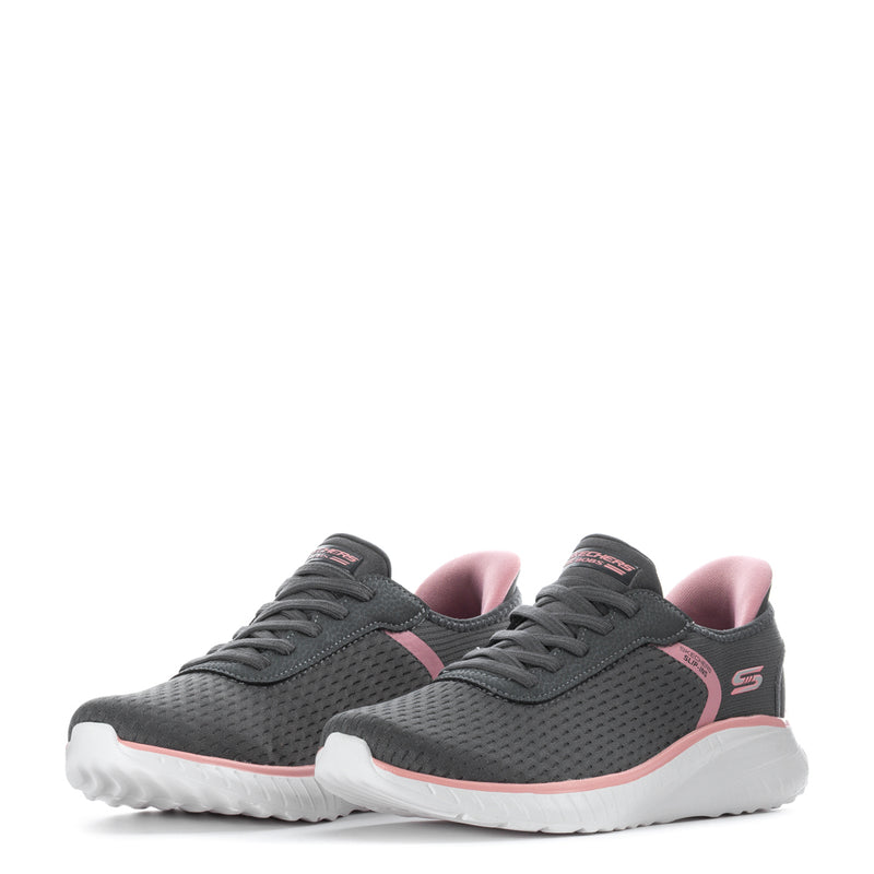Pair of Womens grey slip-in sneakers with pink lining and white cushioned soles