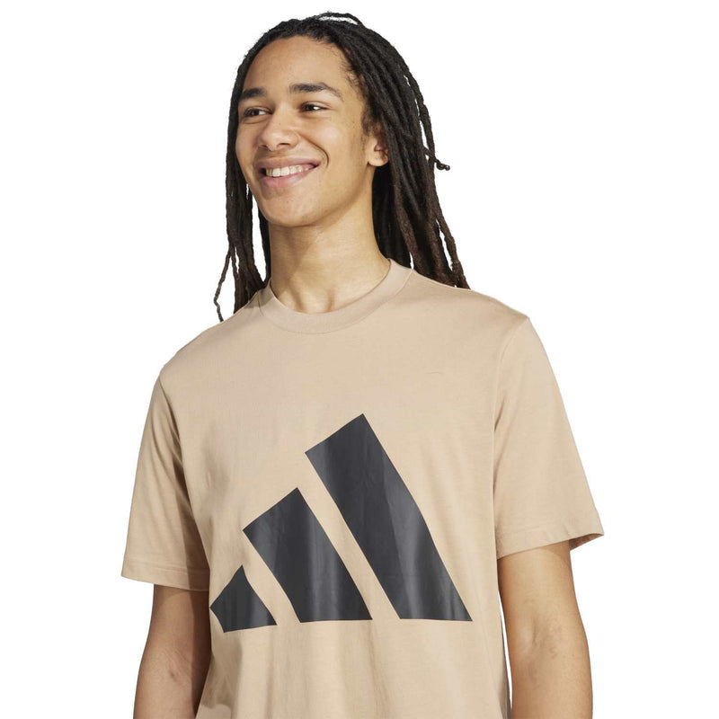 Warm sandstone crew-neck T-shirt with dark logo graphic across the chest