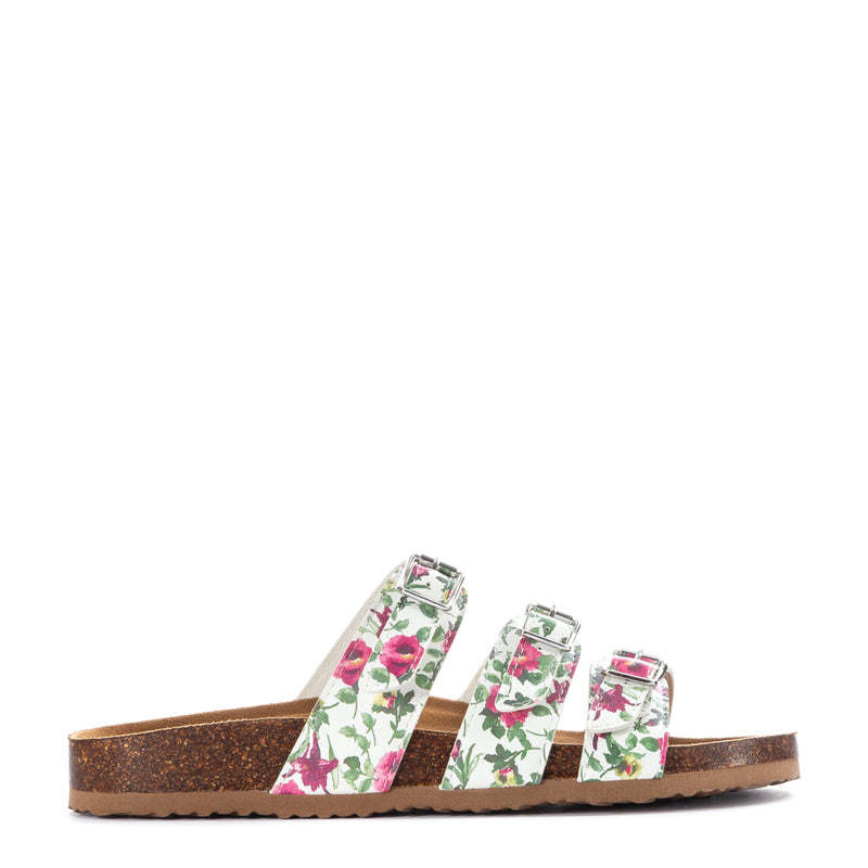 White floral slide sandal with three straps and metal buckles, open toe