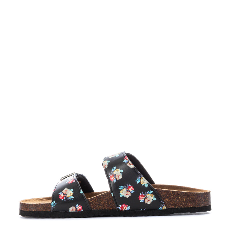 Women’s black floral slide sandals with two buckled straps, side view