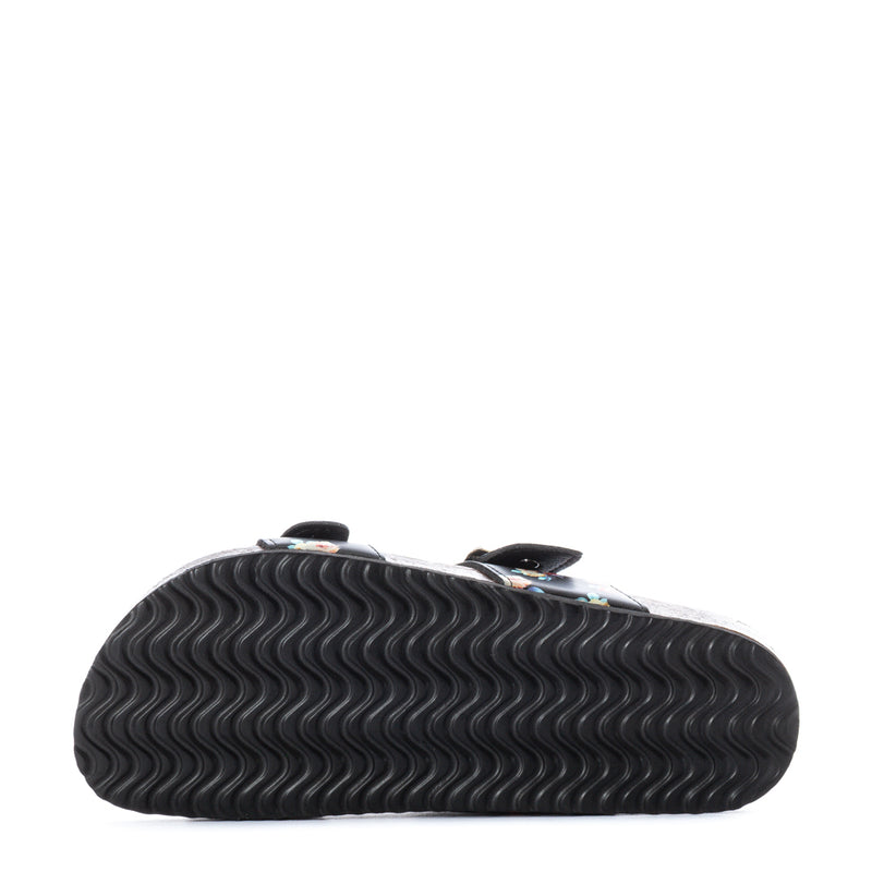 Women’s slide sandal outsole with dark wavy tread pattern