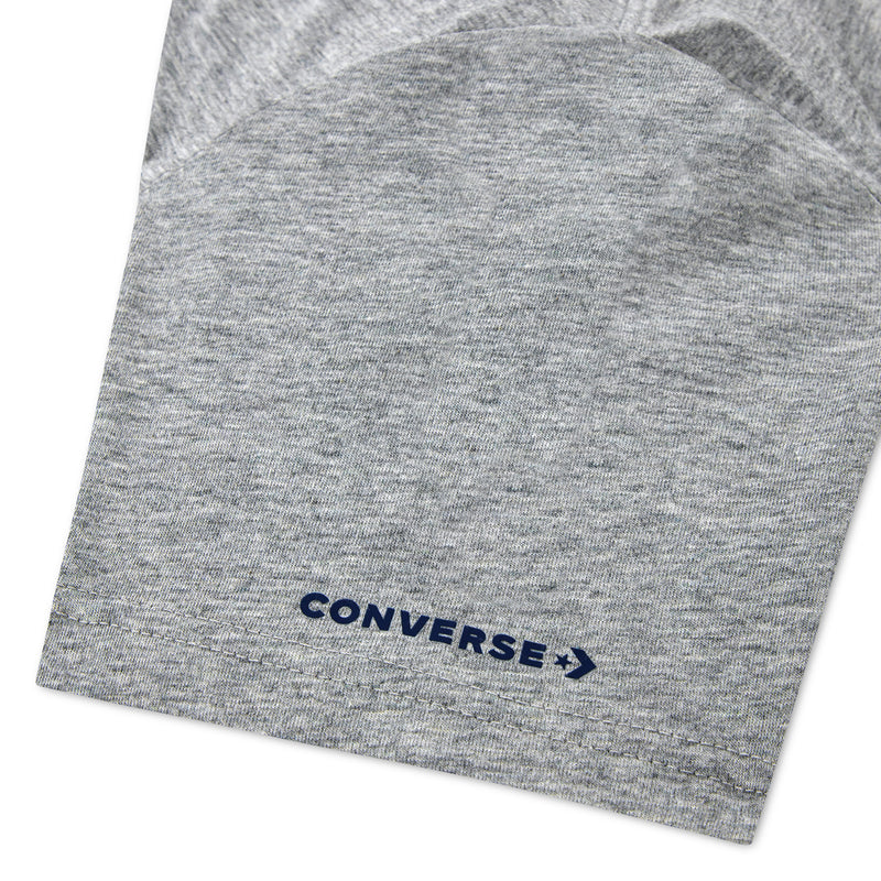 Close-up of Converse logo on hem of dark grey heather youth T-shirt