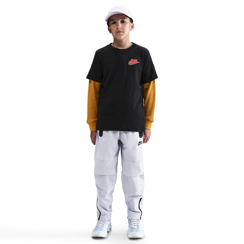 Youth black Nike graphic sports T-shirt with white pants