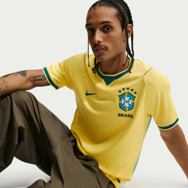 Yellow Brazil home jersey with teal collar trim and CBF crest, front close-up