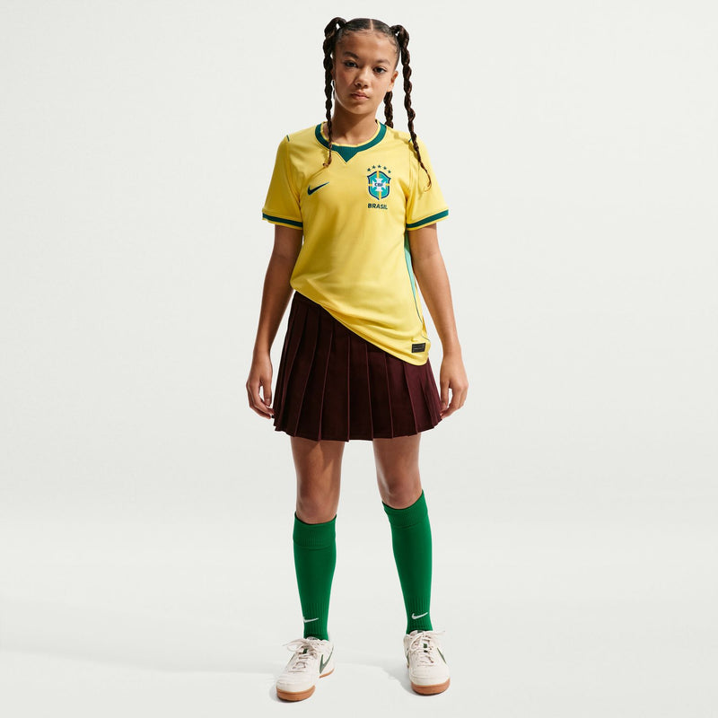 Youth Brazil home soccer jersey in canary yellow with teal trim and CBF crest
