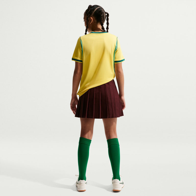 Youth Brazil home soccer jersey back view in canary yellow with teal trim
