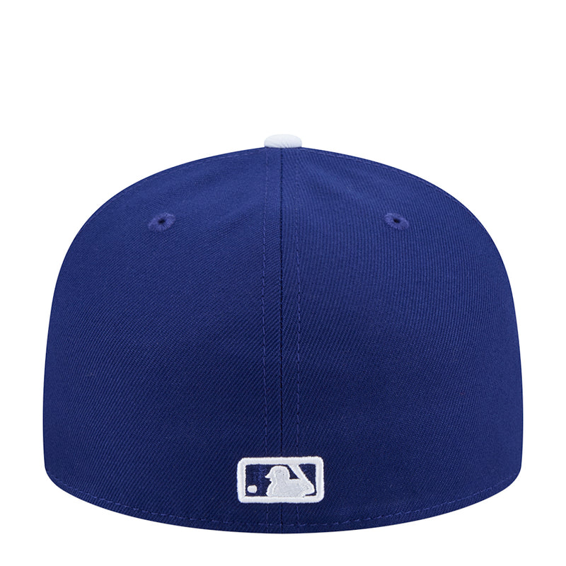 Blue baseball cap with MLB logo patch on the back