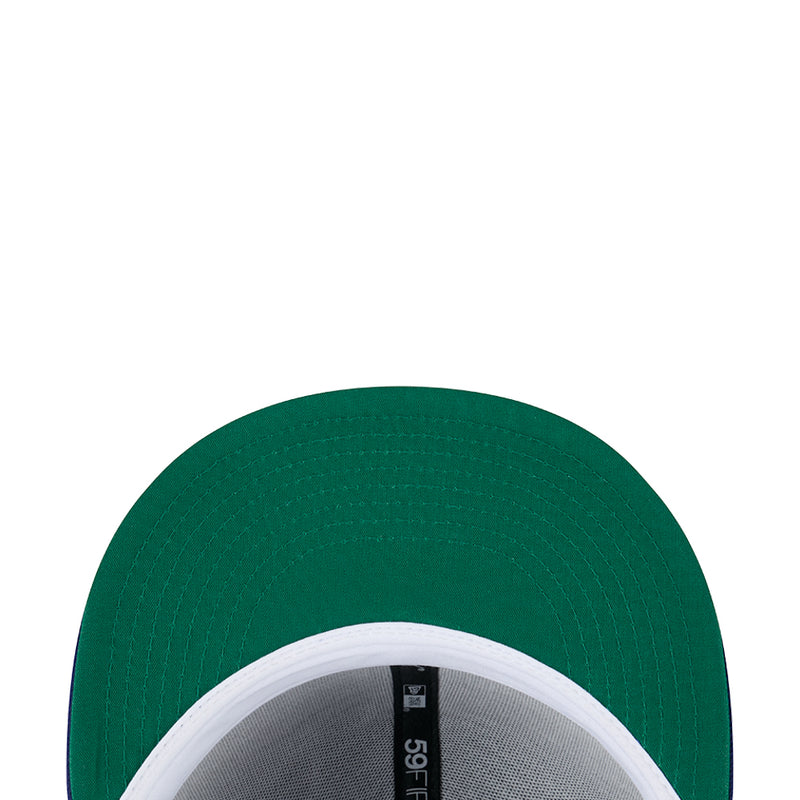 Green baseball cap underside view with stitched brim and inner panel