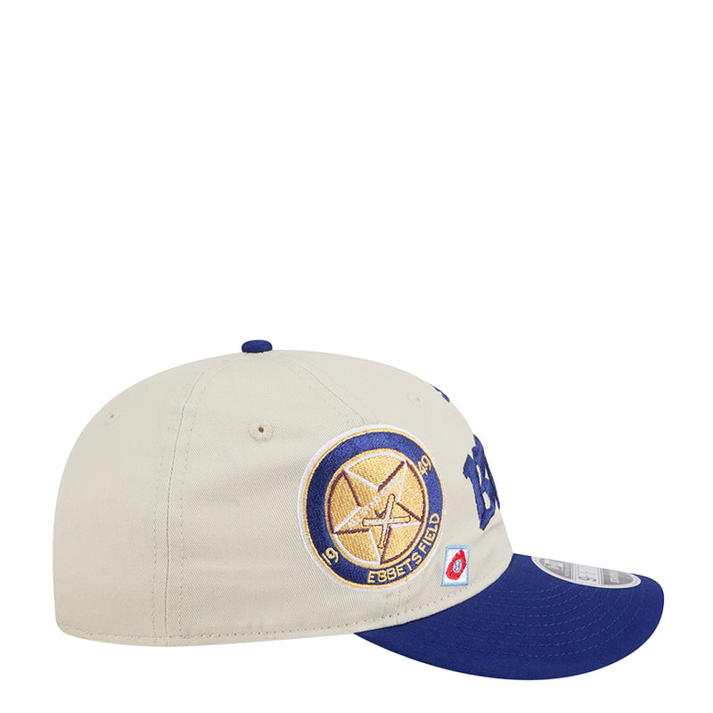 Cream baseball cap with circular patch and large blue Dodgers lettering