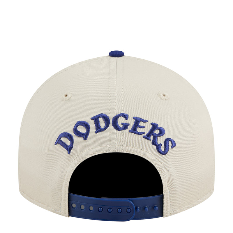 Cream baseball cap with blue DODGERS lettering on the back