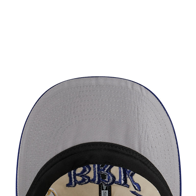 Grey baseball cap close-up with embroidered Brooklyn Dodgers text and black brim