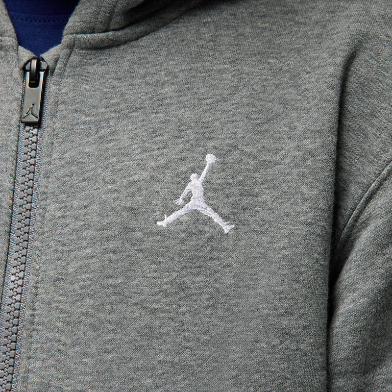 Carbon heather gray hoodie chest close-up with white Jordan silhouette and zipper track