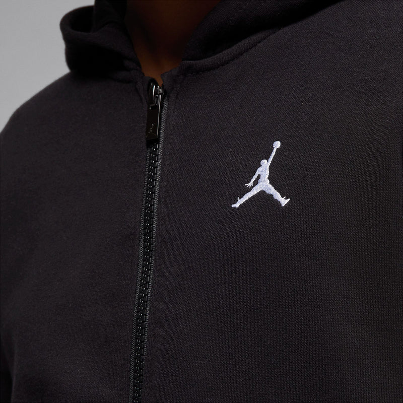 Close-up youth black fleece full-zip hoodie: zipper pull and white Jordan logo