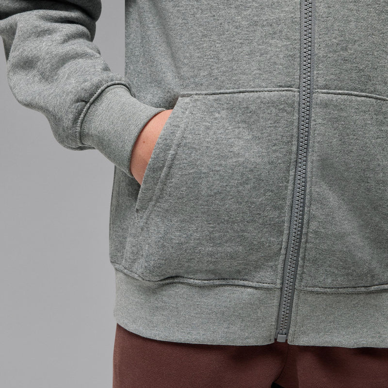Carbon heather gray zip-up hoodie pocket and zipper close-up with ribbed cuffs