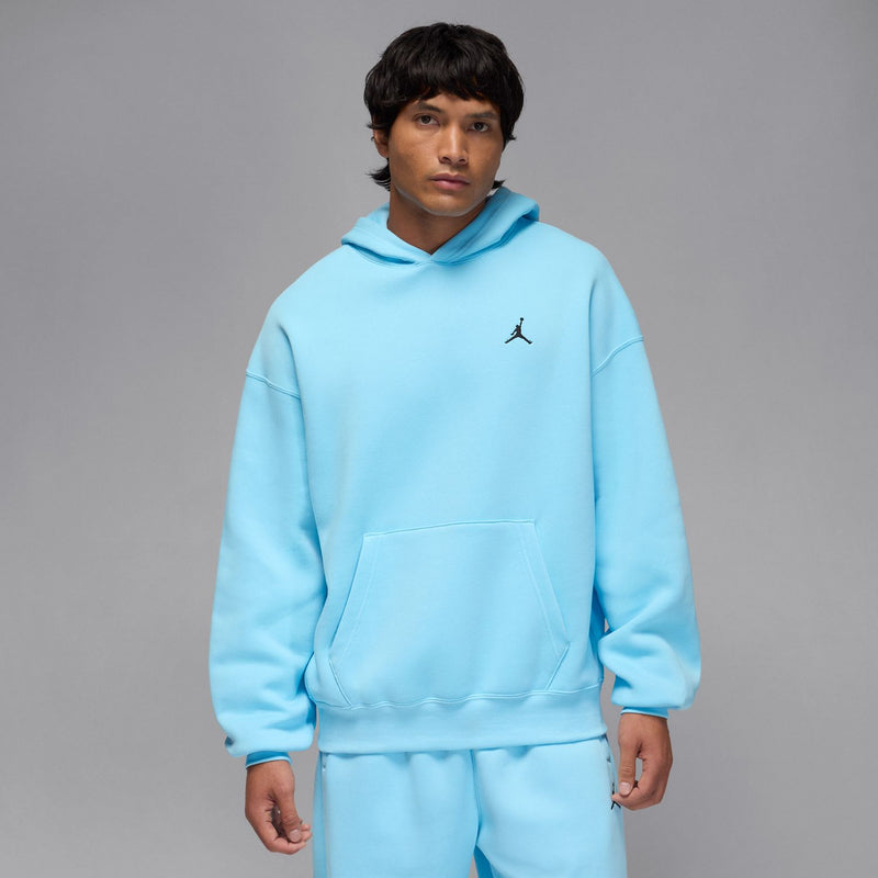 Men's light blue oversized pullover hoodie with drawstring hood and small chest logo