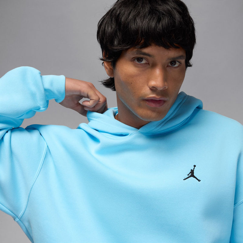 Light blue hoodie with small black chest Jordan logo and adjustable hood drawstrings
