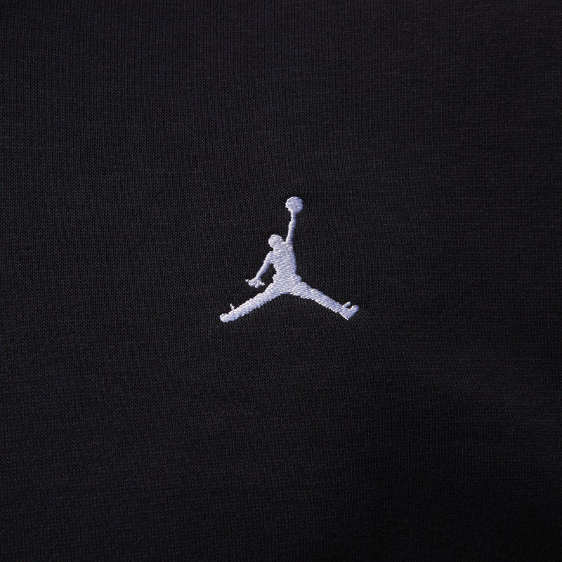 Black fleece hoodie fabric with small white Jumpman logo